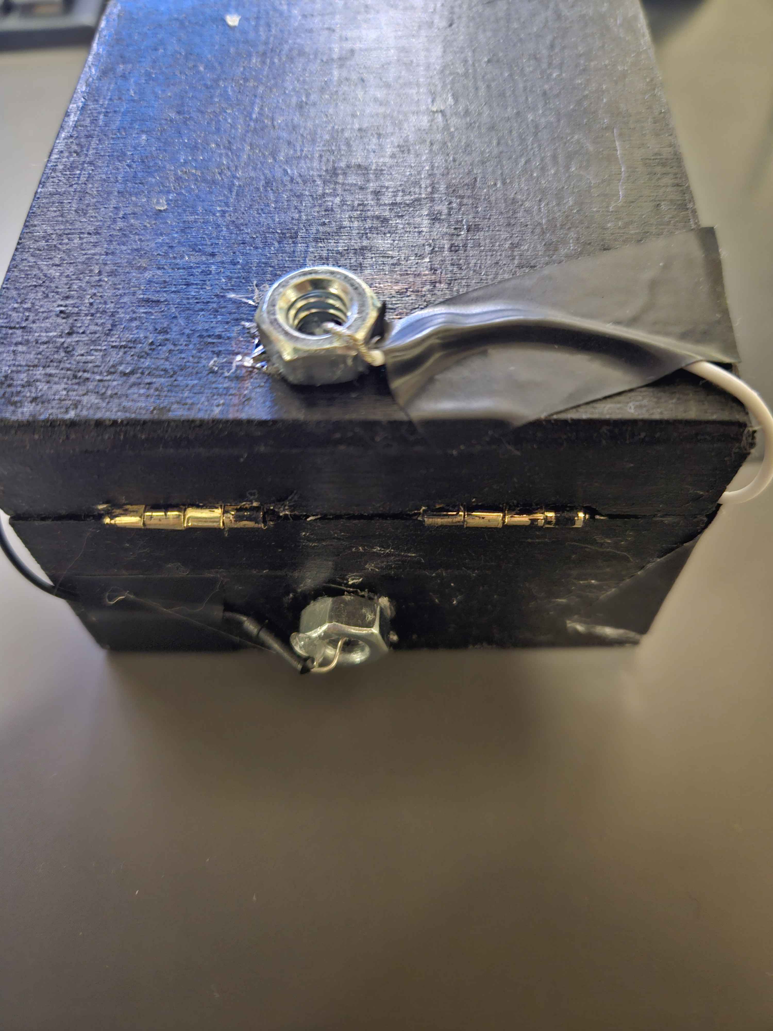 jewellery box, switch is triggered by the two bolts coming into contact. The circuit will complete and the light in the housing will be lit.