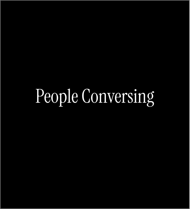 People Conversing in the Hallway